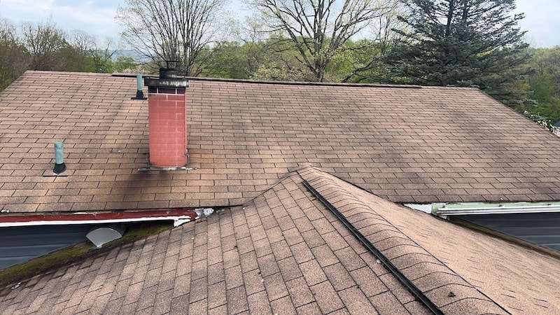 A Home With An Old Roof Awaiting Replacement