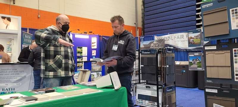 A Homeowner Discussing Their Roofing Project With a Contractor